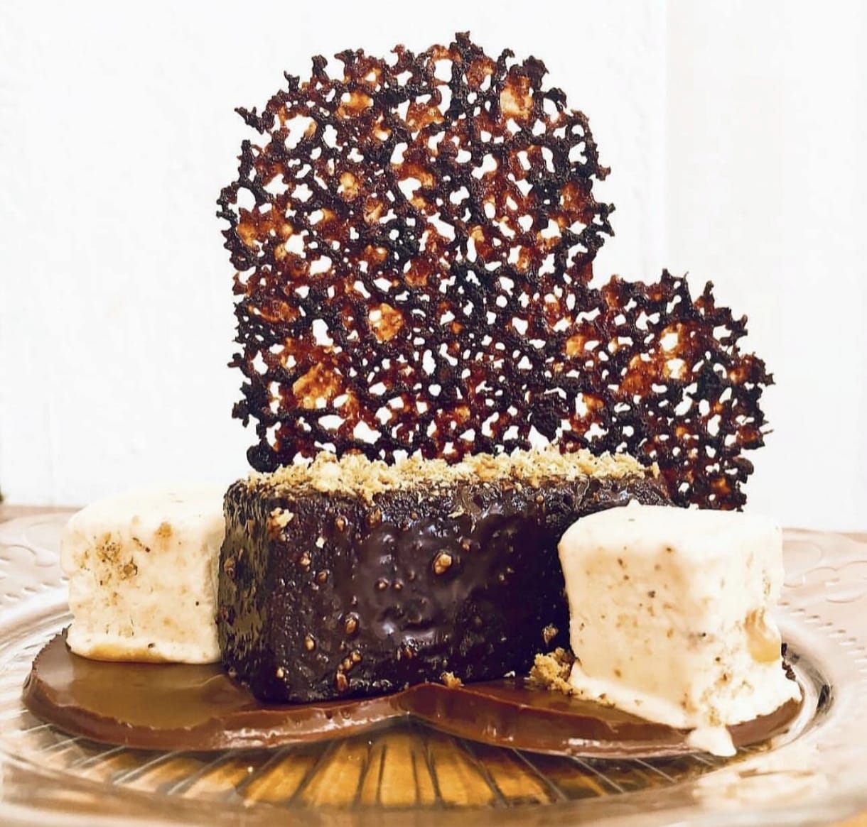Chocolate dessert with a praline tuile and ice cream