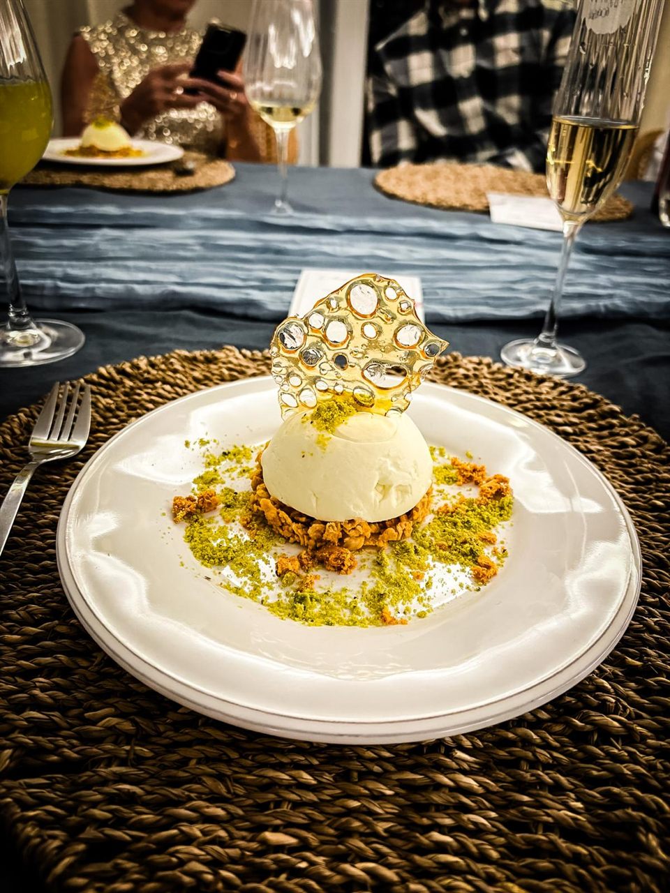 Panna cotta with a honeycomb sugar tuile at a private dinner