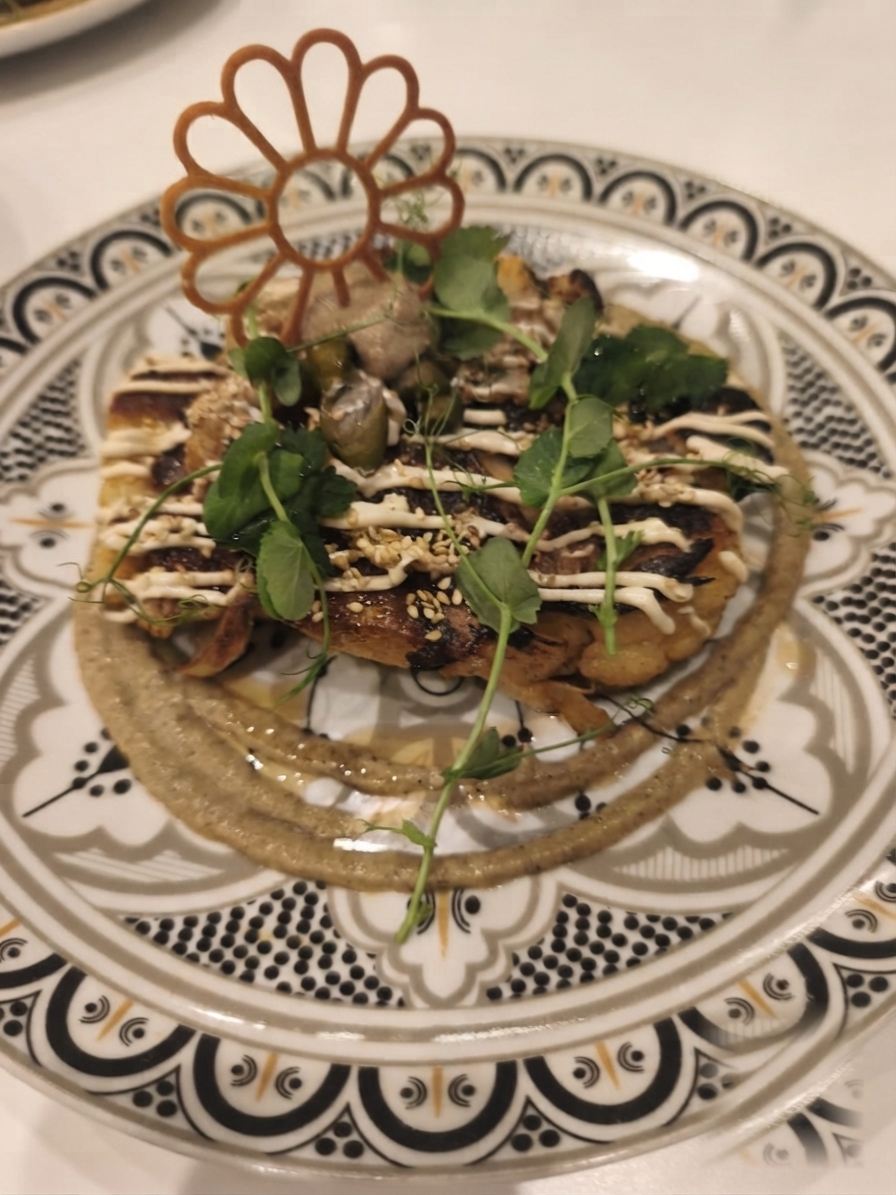 A plated course on a hand-painted Moroccan plate
