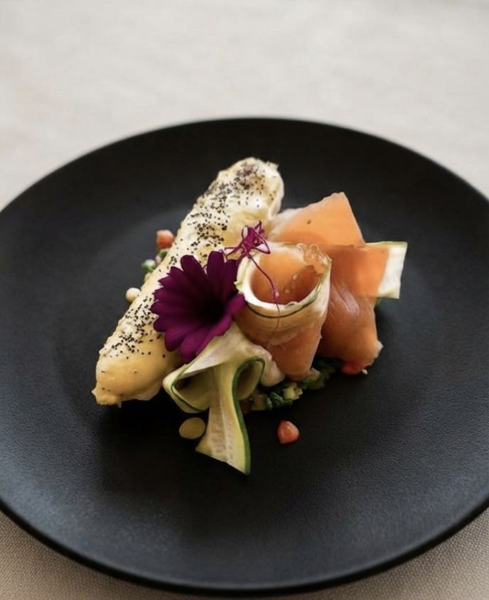 White fish with Iberian jamón and edible flowers